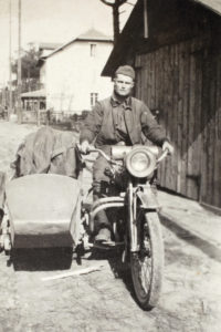 Pvt. Brassey on motorcycle